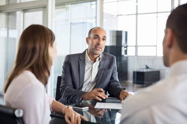 Insurance advisor reviewing policy savings with a client